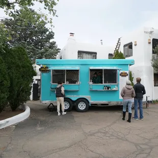 food truck is located behind the lobby of the hotel