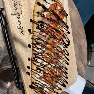 The Caprese Flatbread with Prosciutto added