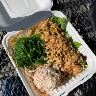 a take out container of food on a table