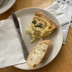 (partially eaten) quiche and baguette