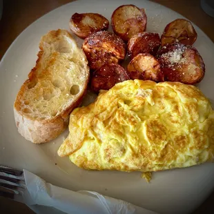 an omelet, potatoes, and toast