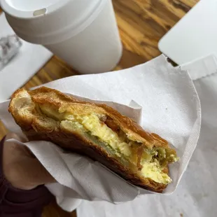 Almond chai ($5.75, 12oz), pesto tomato feta breakfast sandwich on croissant ($5.95)