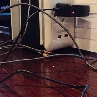 Power stations to charge devices around the bar.