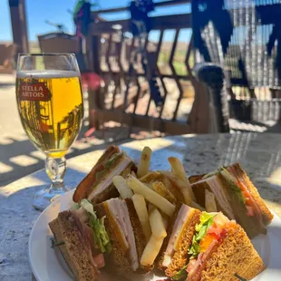 a plate of food and a glass of beer