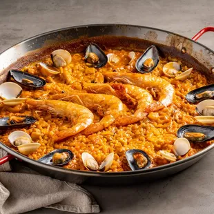 a pan of seafood and rice