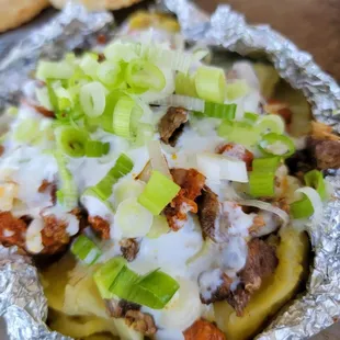Papa location with any protein like asada  , chicken  ,al pastor,  carnitas or just with the toppings.
