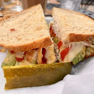 a chicken salad sandwich with pickle