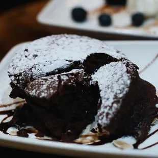 a chocolate dessert with ice cream and blueberries