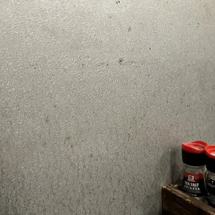 The dried splatter on our wall of the booth