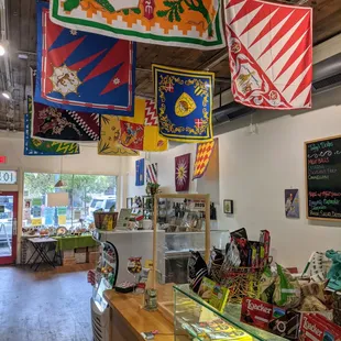 a view of a store with flags hanging from the ceiling