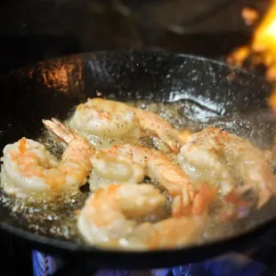 shrimp frying in a frying pan