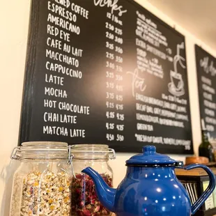 a blue teapot on a wooden table