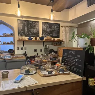 Pastries on counter, specials menu, and regular menu