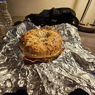 Salami breakfast sandwich on an everything bagel