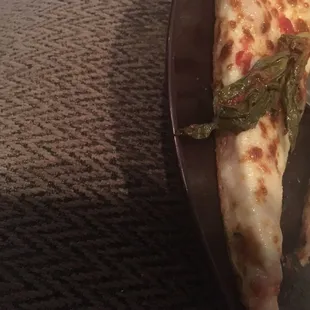 Chuck of basil I found in my pizza. I was told its normal they put basil