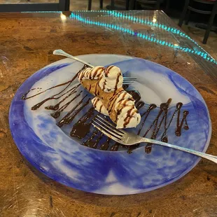 Cannoli creamy, dessert, grizzled with Italian chocolate