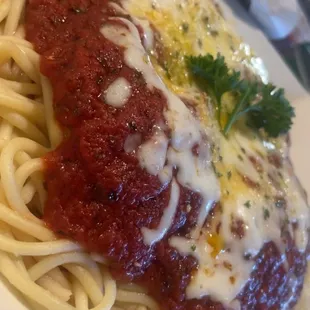 Cheese stuffed ravioli over a bed of spaghetti