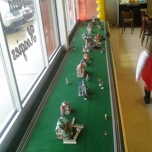 Inside the pizzeria, a train set!