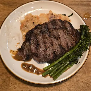 Medium rare rib eye a little dry but tender, mashed and brocolini on point
