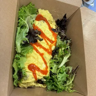 To go Omelette with house made hot sauce