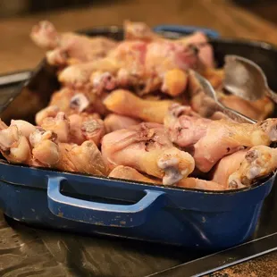 a pan of raw chicken