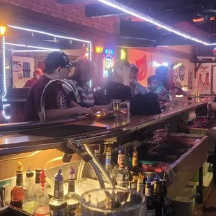 a group of people at a bar