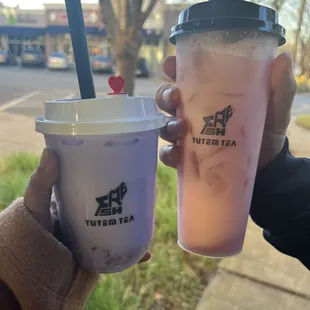 Taro milk tea with white boba and rose milk tea, both delicious