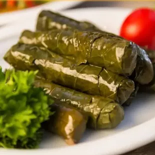 a plate of stuffed grape leaves