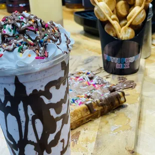 a chocolate milkshake with sprinkles and sprinkles