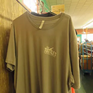 a t - shirt hanging on a rack