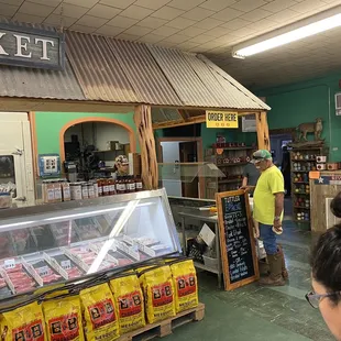 The counter at the back of Tuttle's, where all the magic happens.  The meat market is epic as well...