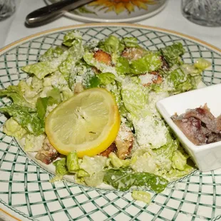 Half of a Caesar salad. Generous with the anchovies