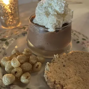 a plate of food and a glass of wine