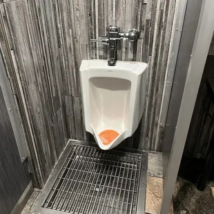 solution to keeping men's room floor from being disgustingly wet