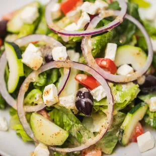 Greek Salad
Romaine lettuce, tomatoes, cucumbers, red onions, feta cheese, and olives with a Greek-oregano dressing.