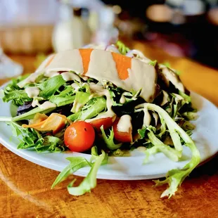 House salade with dreamy creamy balsamic dressing. Highly Recommend.