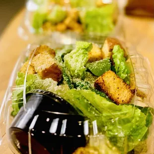 2 Cesar side salads to go.
