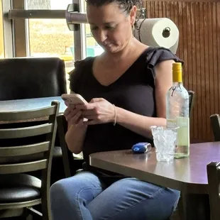 I love the way that this young bartender is taking a break!