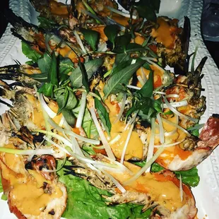 a plate of grilled shrimp