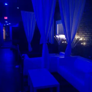 a couch and a table in a dimly lit room