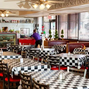 a diner with checkered tables and chairs