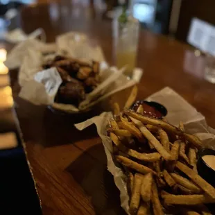 two baskets of fries on a table