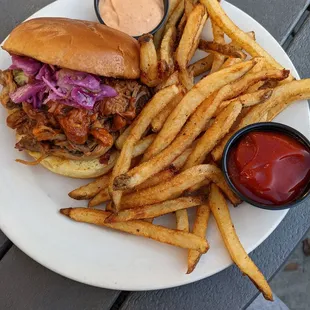 Pulled pork sandwich with lovely fries, add sriracha mayo