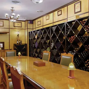 a long table with wine bottles on it