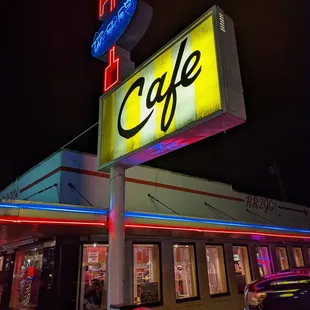 a neon sign for a cafe