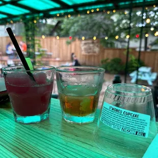 three different drinks on a table