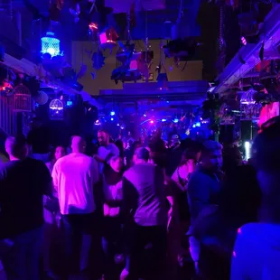 a crowd of people dancing in a nightclub