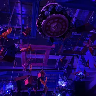 a clock suspended from the ceiling