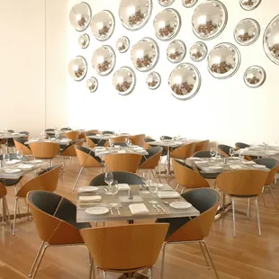 a dining room with many tables and chairs