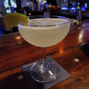 a margarita with a lime slice on the rim